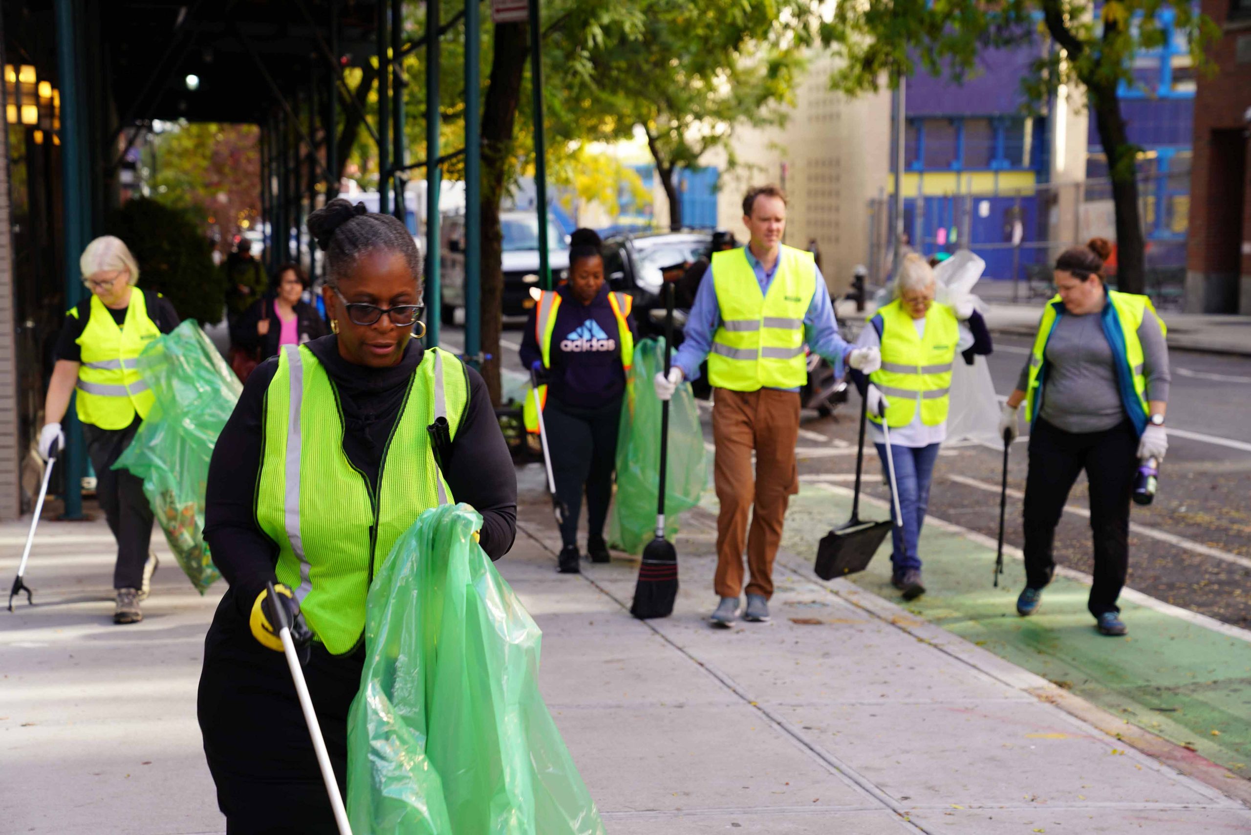 people cleaning the streets